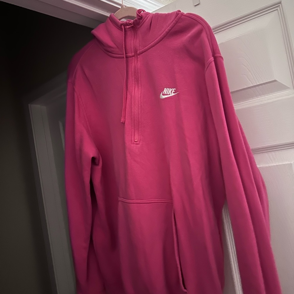Pink Nike quarter zip with a hood